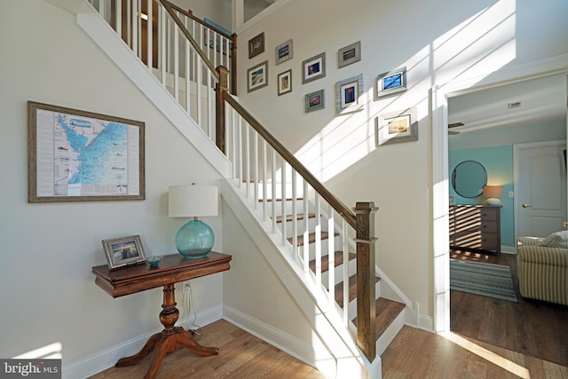 stairs with wood-type flooring