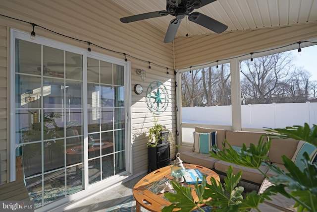 sunroom / solarium featuring wood ceiling and ceiling fan