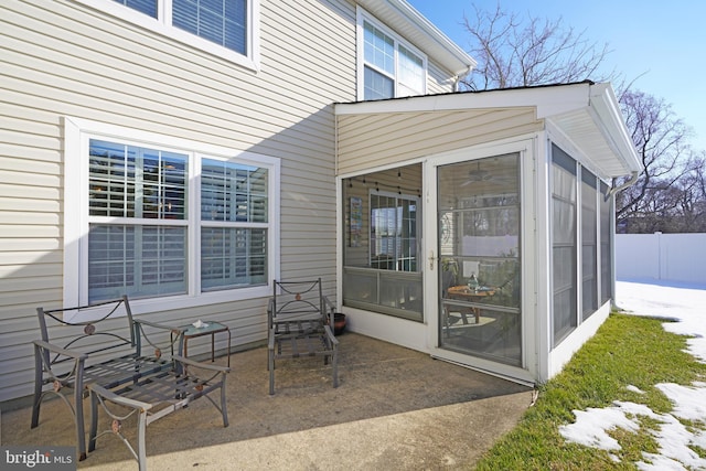 view of patio with a sunroom