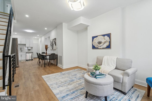 sitting room with light wood-type flooring