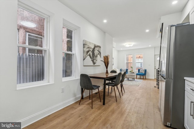 dining room with light wood-type flooring