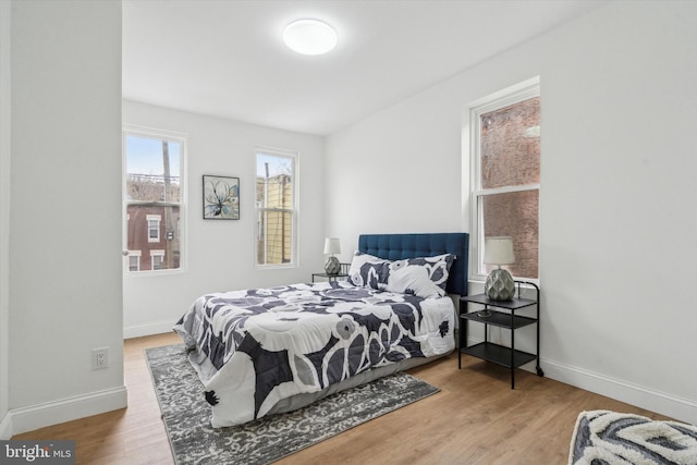 bedroom with wood-type flooring