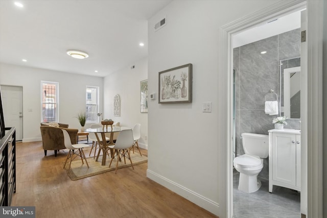 dining space featuring hardwood / wood-style flooring