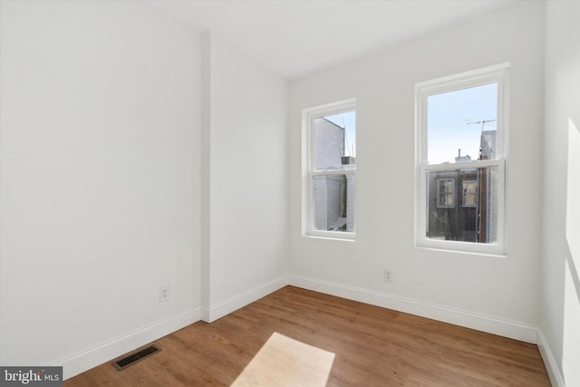 unfurnished room featuring light wood-type flooring