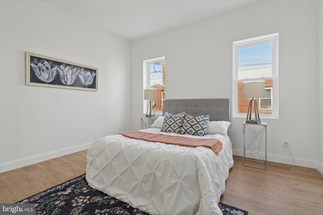 bedroom with light hardwood / wood-style floors