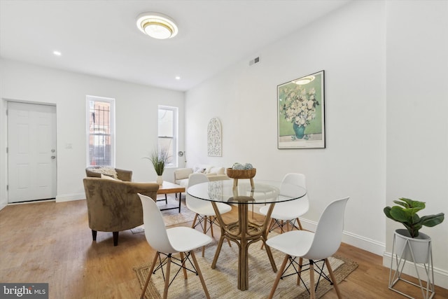 dining space featuring light hardwood / wood-style flooring