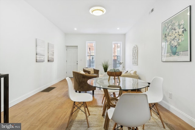 dining room featuring light hardwood / wood-style flooring