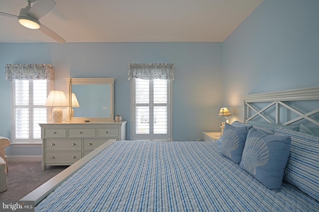 carpeted bedroom featuring ceiling fan