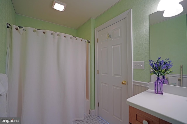 bathroom featuring tile patterned floors and shower / bath combo with shower curtain