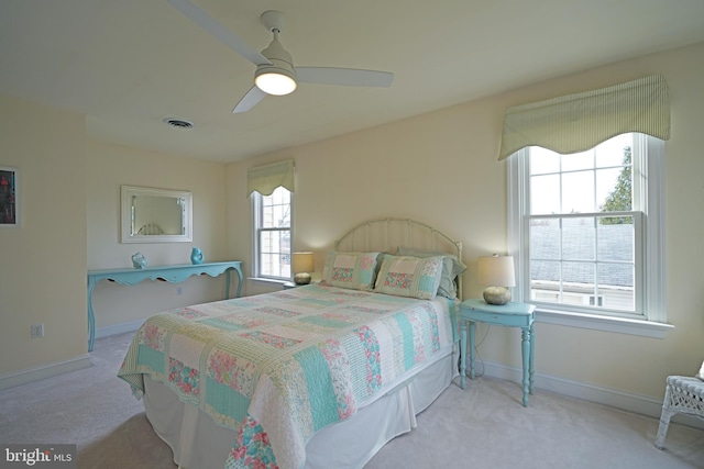 bedroom featuring ceiling fan and light colored carpet