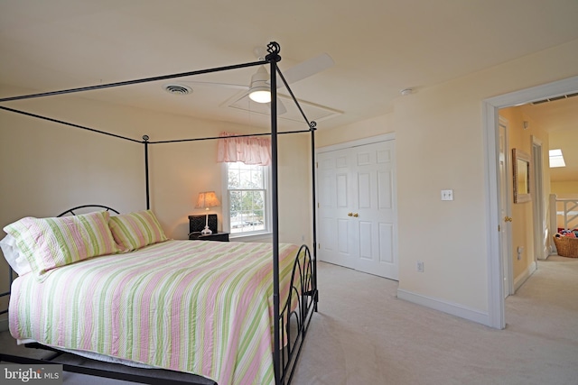 bedroom with light carpet, ceiling fan, and a closet