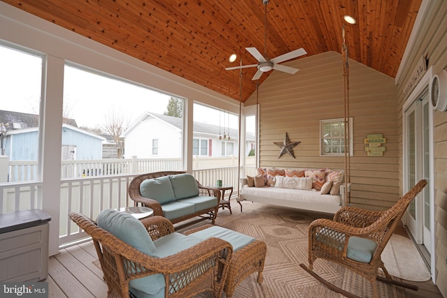 sunroom / solarium with vaulted ceiling, wooden ceiling, and ceiling fan