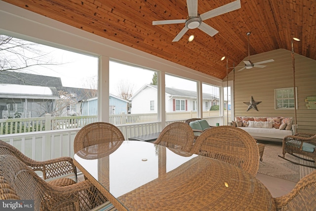 sunroom with wood ceiling, lofted ceiling, and a wealth of natural light