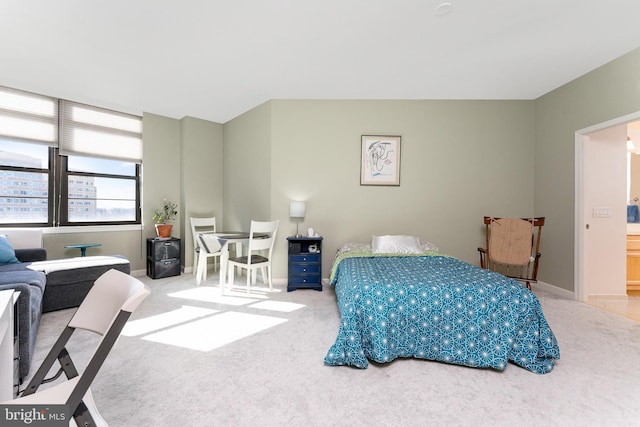 bedroom featuring light colored carpet