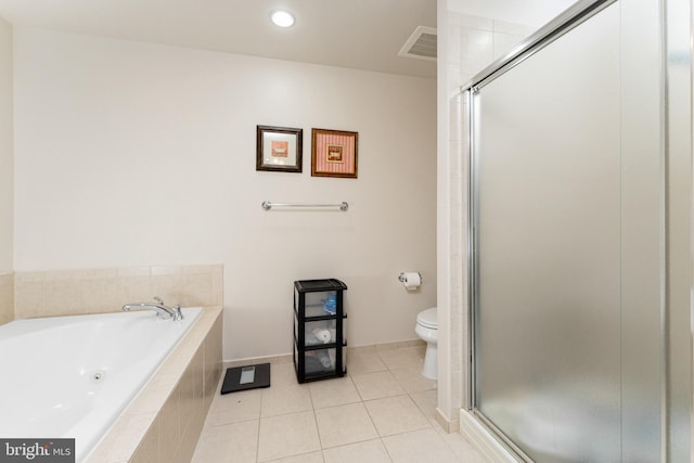 bathroom featuring tile patterned flooring, plus walk in shower, and toilet