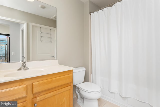 full bathroom featuring tile patterned flooring, vanity, shower / bath combo, and toilet