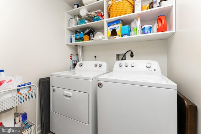 laundry room with washing machine and clothes dryer