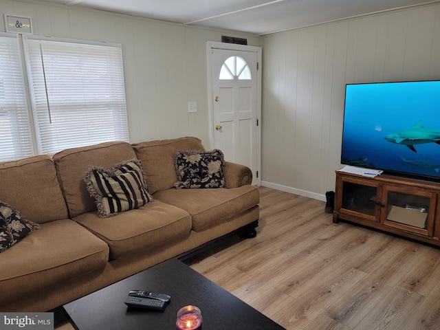 living room with light hardwood / wood-style flooring