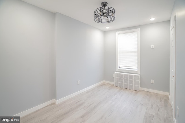 spare room with light wood-type flooring