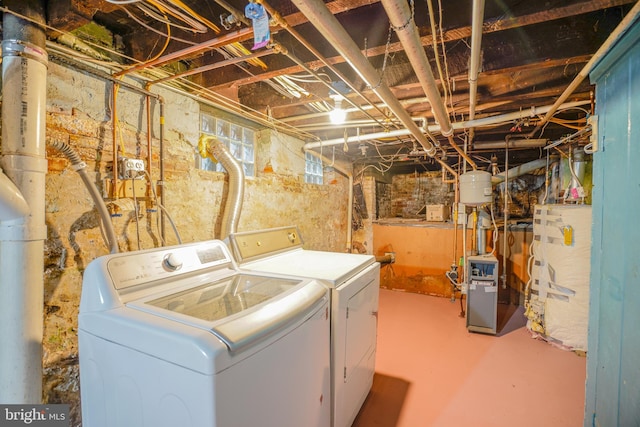 laundry area featuring washer and clothes dryer and gas water heater