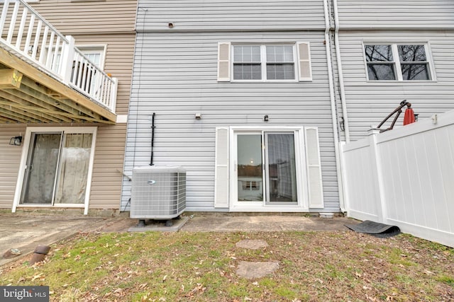 back of property with central AC unit