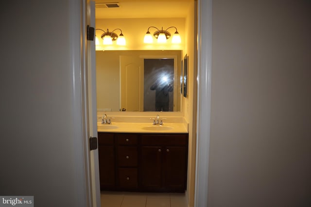 bathroom with vanity and tile patterned flooring