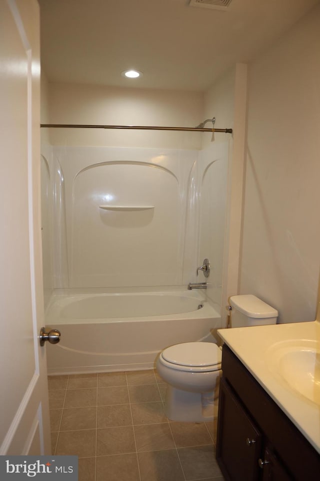 full bathroom featuring vanity, tub / shower combination, tile patterned floors, and toilet