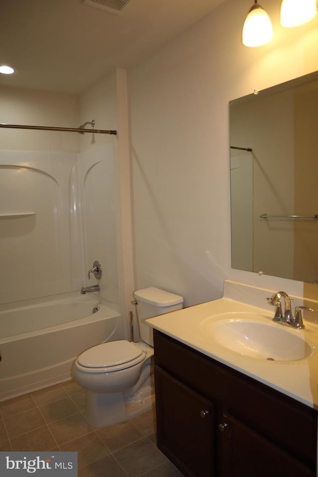 full bathroom with tile patterned floors, toilet, shower / bathing tub combination, and vanity