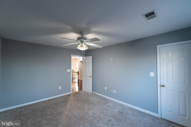 carpeted empty room with ceiling fan