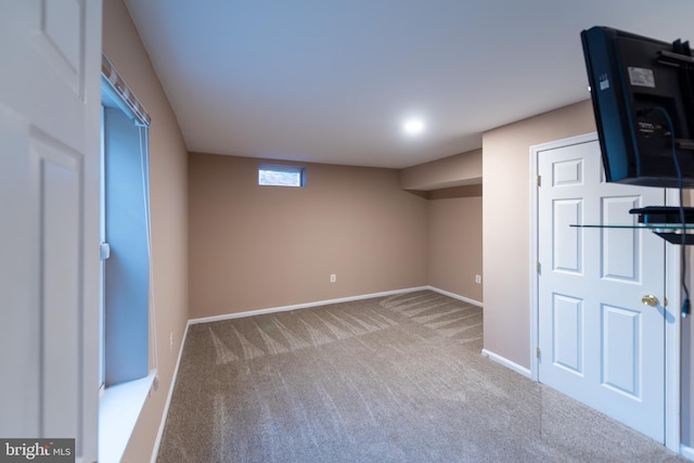 basement with light colored carpet