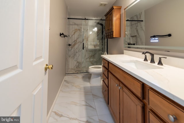 bathroom featuring vanity, an enclosed shower, and toilet