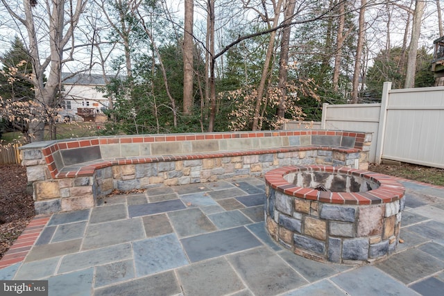 view of patio / terrace featuring an outdoor fire pit