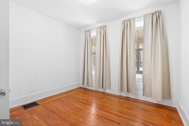 empty room featuring hardwood / wood-style floors