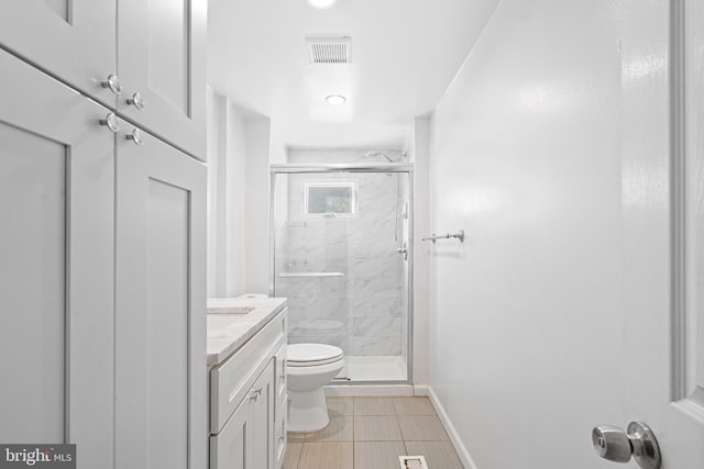 bathroom with vanity, toilet, and walk in shower