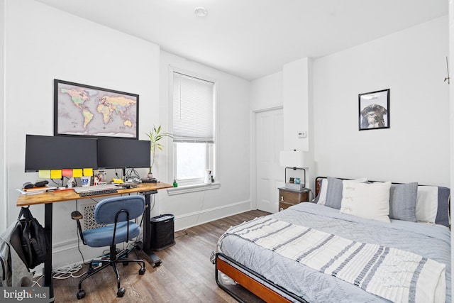 bedroom featuring wood-type flooring