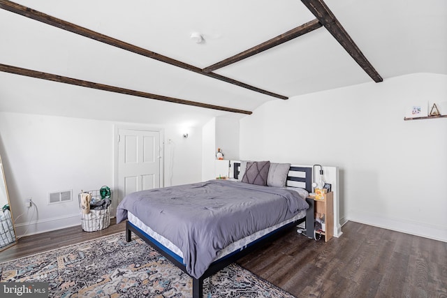 bedroom featuring dark wood-type flooring and lofted ceiling with beams