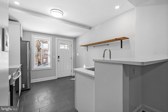 kitchen featuring stainless steel appliances and kitchen peninsula