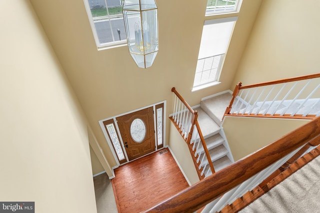 99 Trumpeter Swan Way, Magnolia, DE 19962 - entrance foyer with a towering ceiling, stairs, baseboards, and carpet