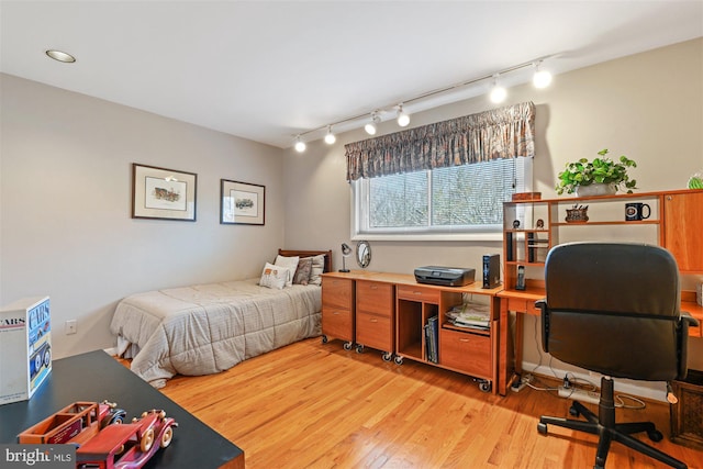 bedroom featuring light wood-style flooring