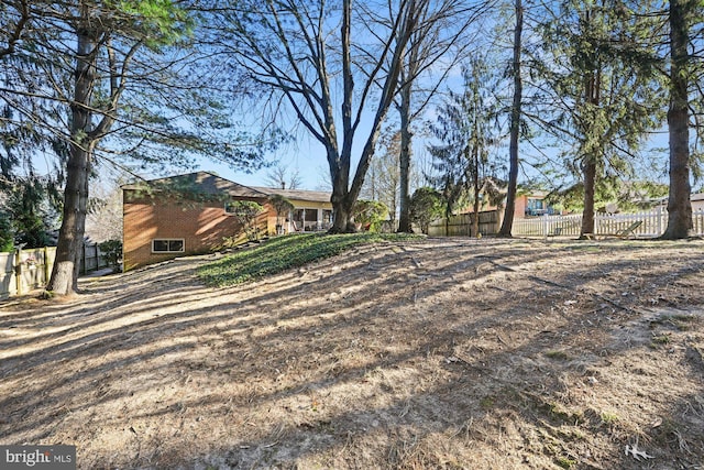 view of yard featuring fence