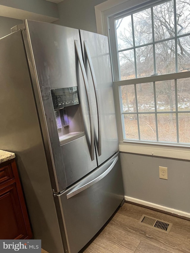 9429 Fairhaven Ave, Upper Marlboro, MD 20772 - kitchen featuring light wood-type flooring, stainless steel fridge, and plenty of natural light