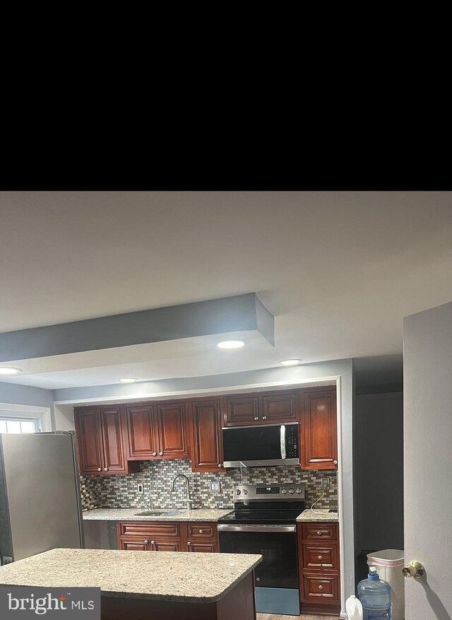 9429 Fairhaven Ave, Upper Marlboro, MD 20772 - kitchen with tasteful backsplash, appliances with stainless steel finishes, and sink