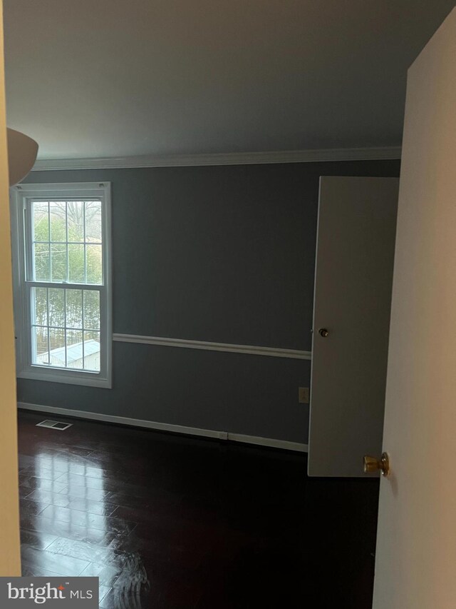 9429 Fairhaven Ave, Upper Marlboro, MD 20772 - empty room with crown molding and dark wood-type flooring