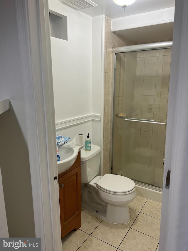 9429 Fairhaven Ave, Upper Marlboro, MD 20772 - bathroom featuring an enclosed shower, vanity, tile patterned floors, and toilet