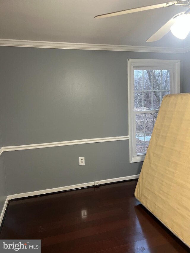 9429 Fairhaven Ave, Upper Marlboro, MD 20772 - unfurnished bedroom with crown molding, dark wood-type flooring, and ceiling fan
