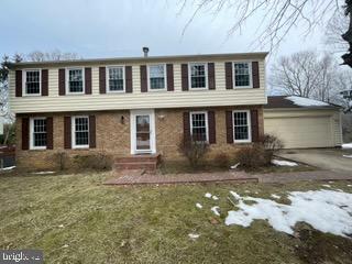9429 Fairhaven Ave, Upper Marlboro, MD 20772 - colonial house with a garage and a front yard
