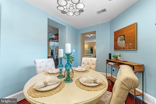 dining space featuring hardwood / wood-style floors