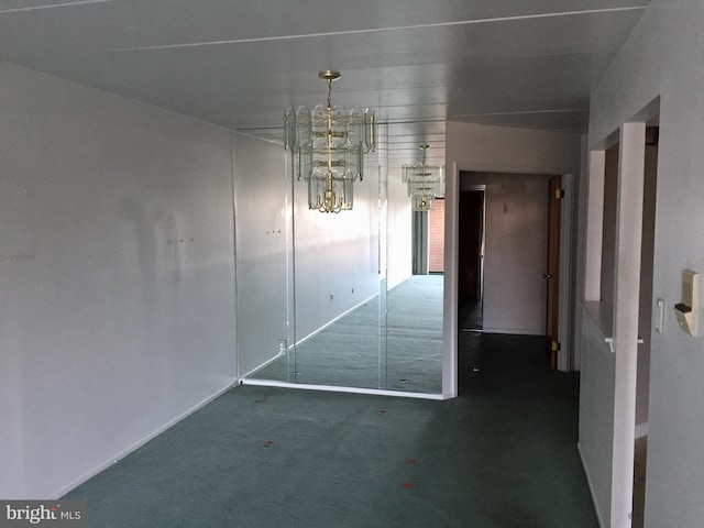 interior space featuring a chandelier and dark colored carpet