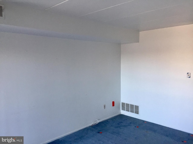 unfurnished room featuring carpet