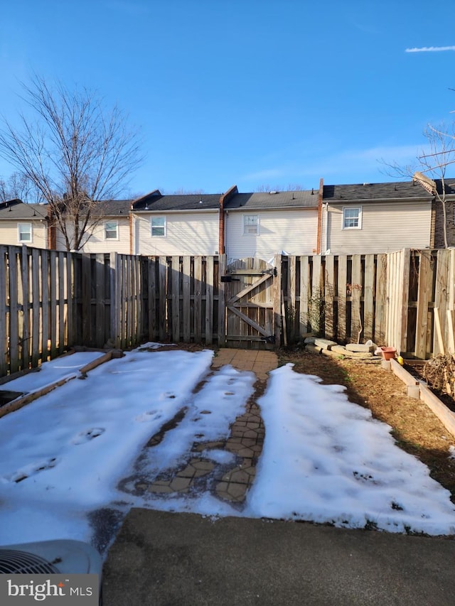 view of yard layered in snow